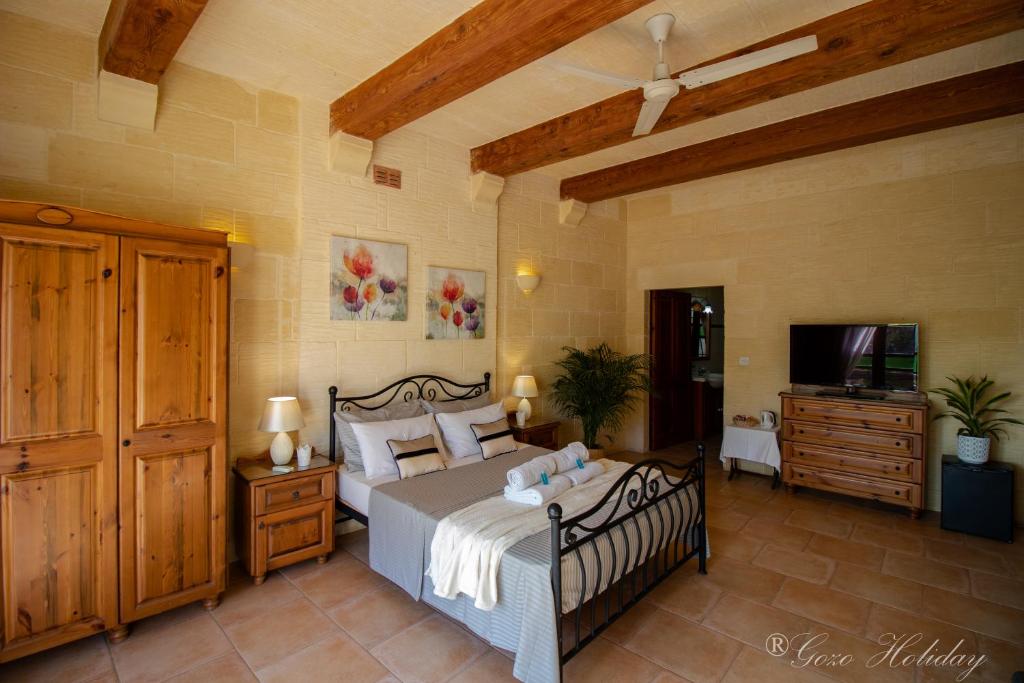 Letto o letti in una camera di Lellux Qala