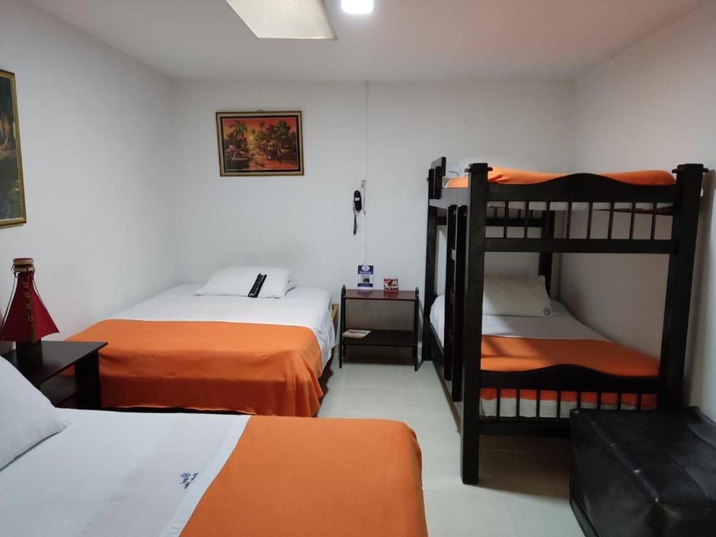 Postel nebo postele na pokoji v ubytování Hotel Mirador Plaza