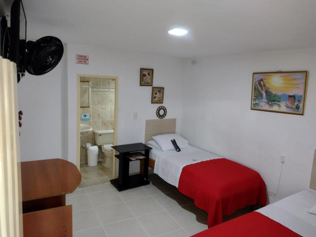 Postel nebo postele na pokoji v ubytování Hotel Mirador Plaza