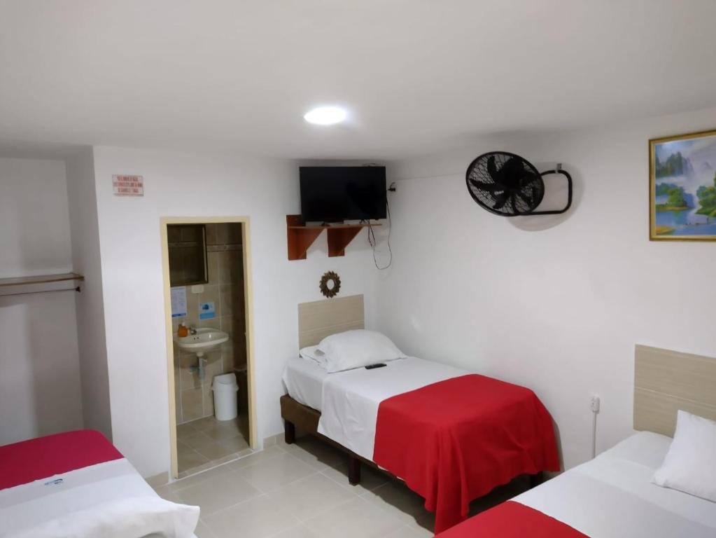 Postel nebo postele na pokoji v ubytování Hotel Mirador Plaza