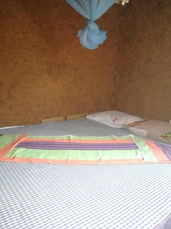Postel nebo postele na pokoji v ubytování Bimanjee Mango Resort