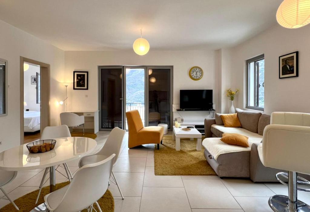 a living room with a couch and a table at Lavender Bay Apartment C23 in Kotor