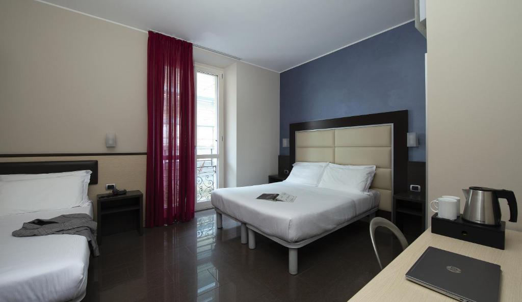 Postel nebo postele na pokoji v ubytování Hotel Five