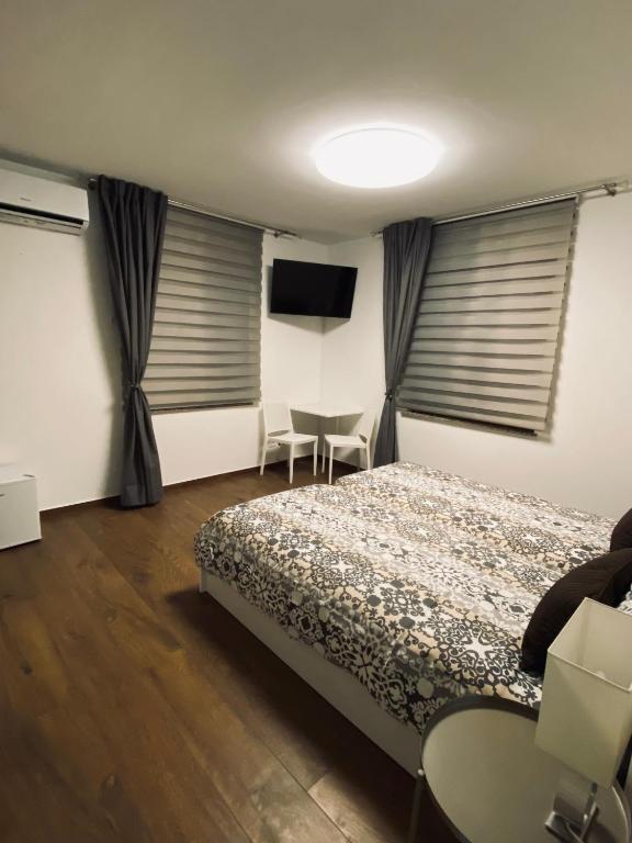 Postel nebo postele na pokoji v ubytování Affittacamere da Jasmina Venzone
