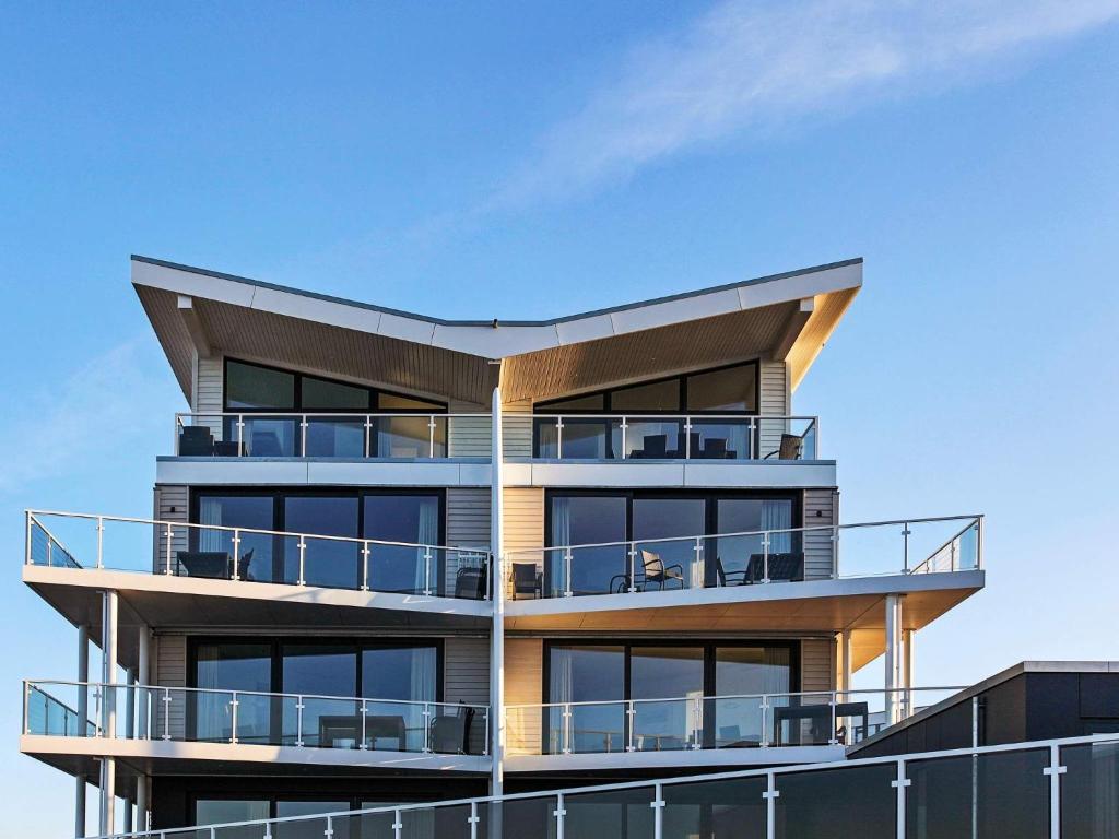 a building with balconies on the side of it at 8 person holiday home in Wendtorf in Wendtorf