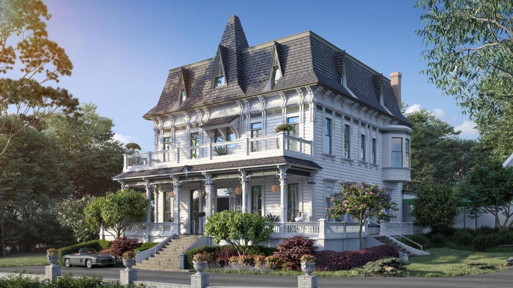 une grande maison blanche avec un toit en gambrel dans l'établissement The Madrona, à Healdsburg