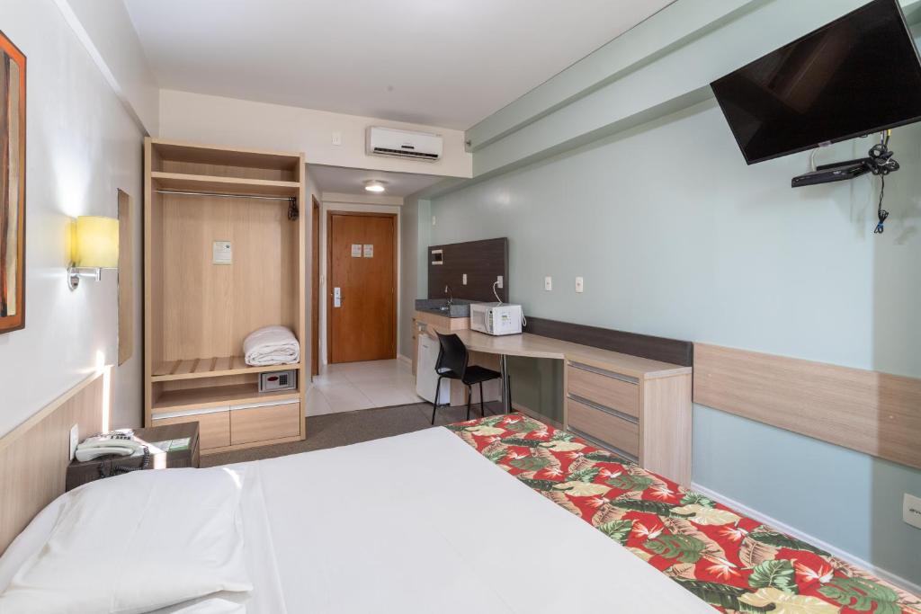 Postel nebo postele na pokoji v ubytování Eko Residence Hotel - próximo a Santa Casa e Auditório Araujo Vianna