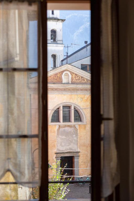 a view of a building from a window at Appartamento Sant'Agostino in Tirano