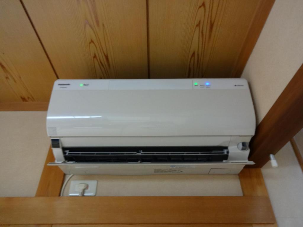 a printer sitting on a shelf in a room at Jizokan Matsuya Ryokan in Nagano