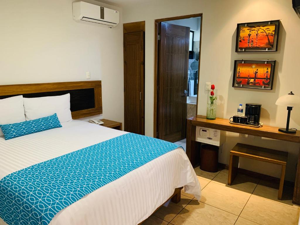 Postel nebo postele na pokoji v ubytování Rymma Hotel