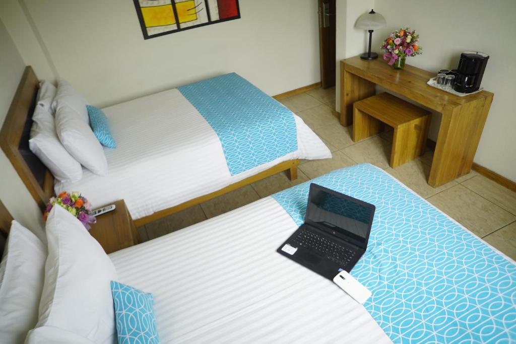Postel nebo postele na pokoji v ubytování Rymma Hotel