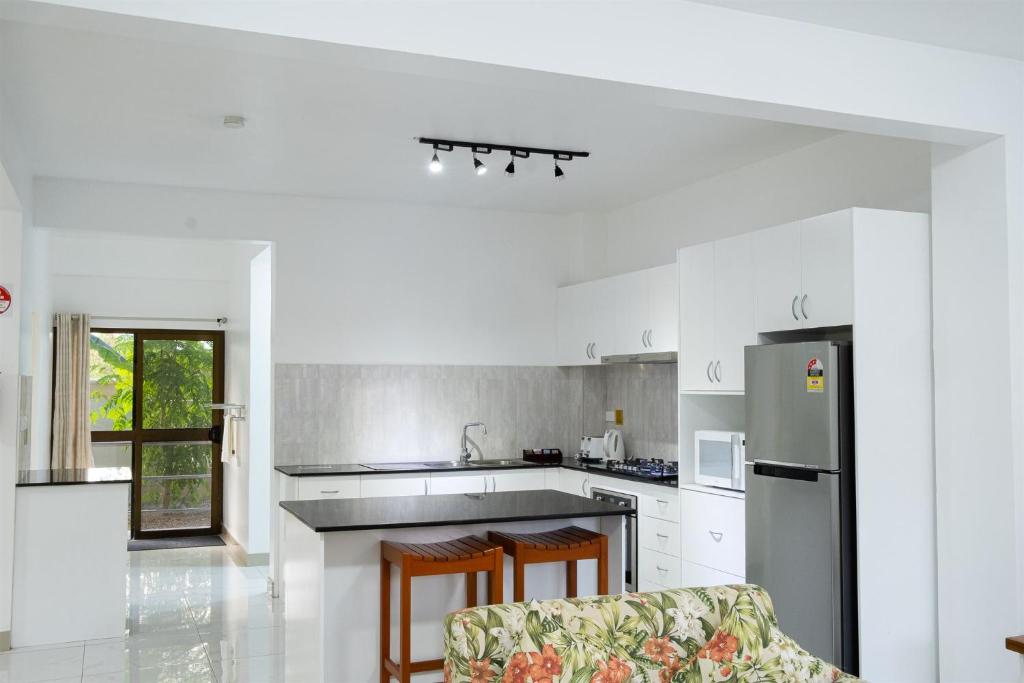 Kuchyň nebo kuchyňský kout v ubytování Coastal Suites Fiji