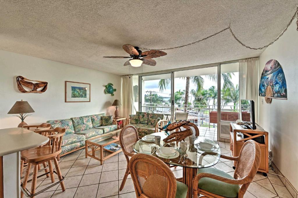 a living room with a couch and a table at Condo with Private Lanai, Ocean View and On-Site Pool! in Kihei