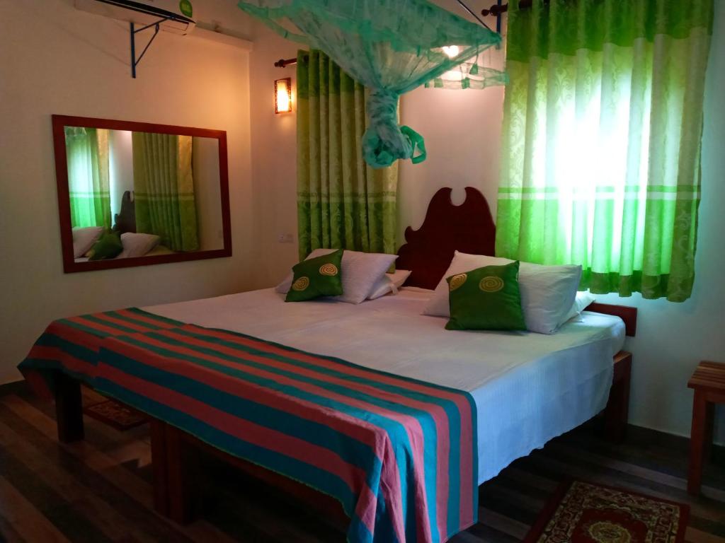 Postel nebo postele na pokoji v ubytování Hideaway Homestay Habarana