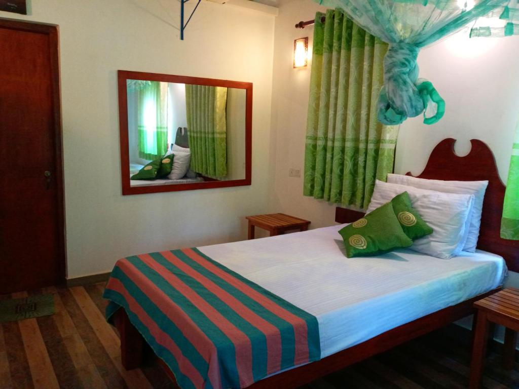 Postel nebo postele na pokoji v ubytování Hideaway Homestay Habarana