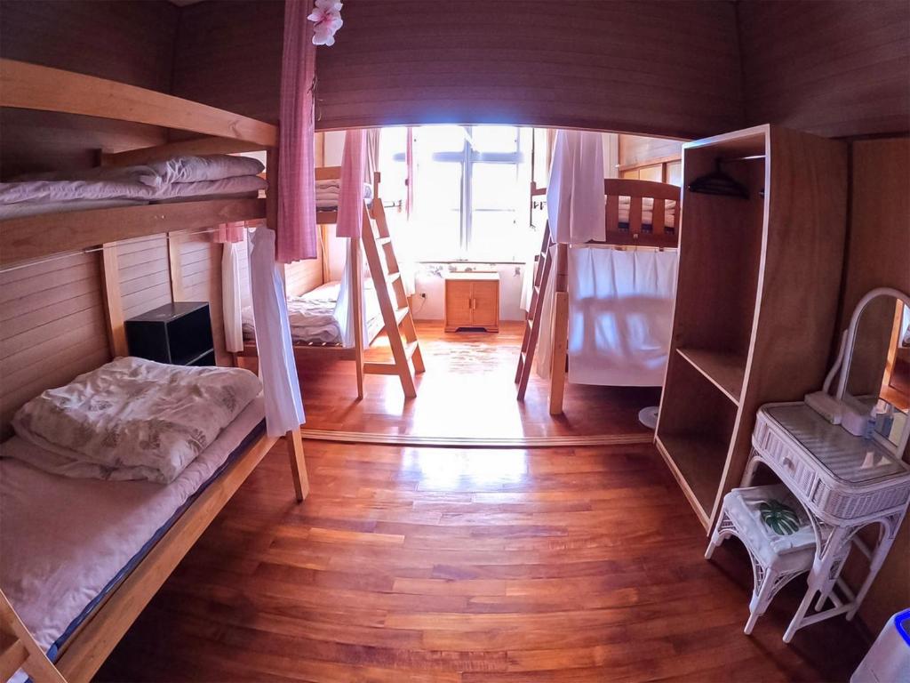 an overhead view of a room with bunk beds at Emix Ishigaki in Ishigaki Island