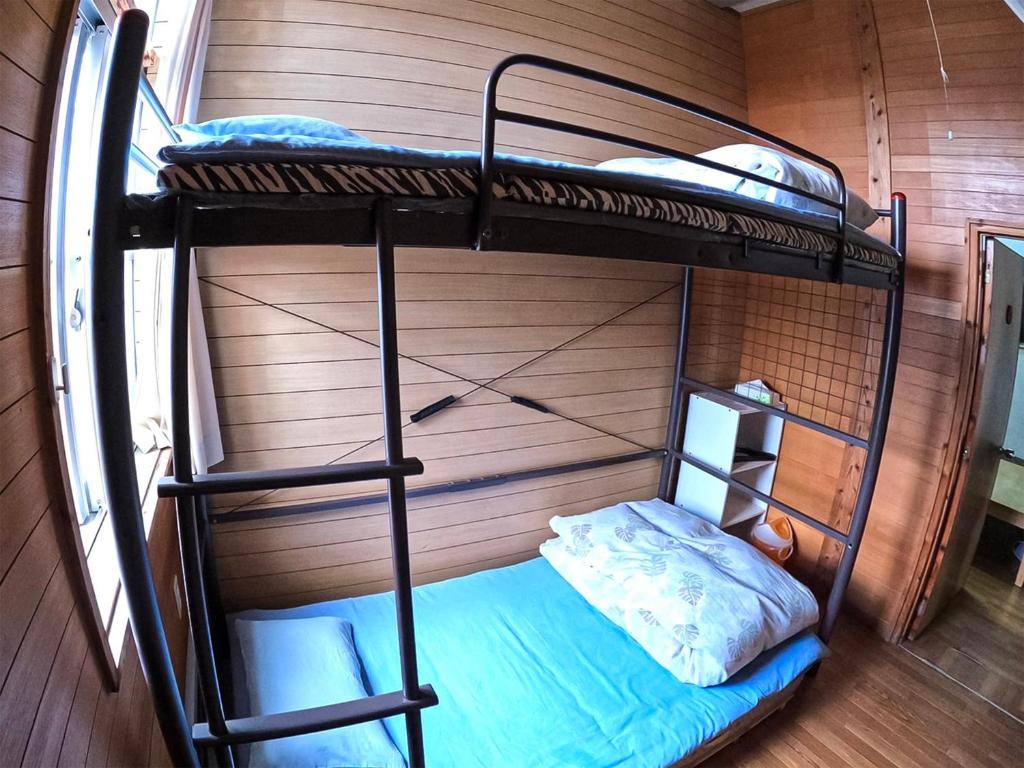 Postel nebo postele na pokoji v ubytování Emix Ishigaki