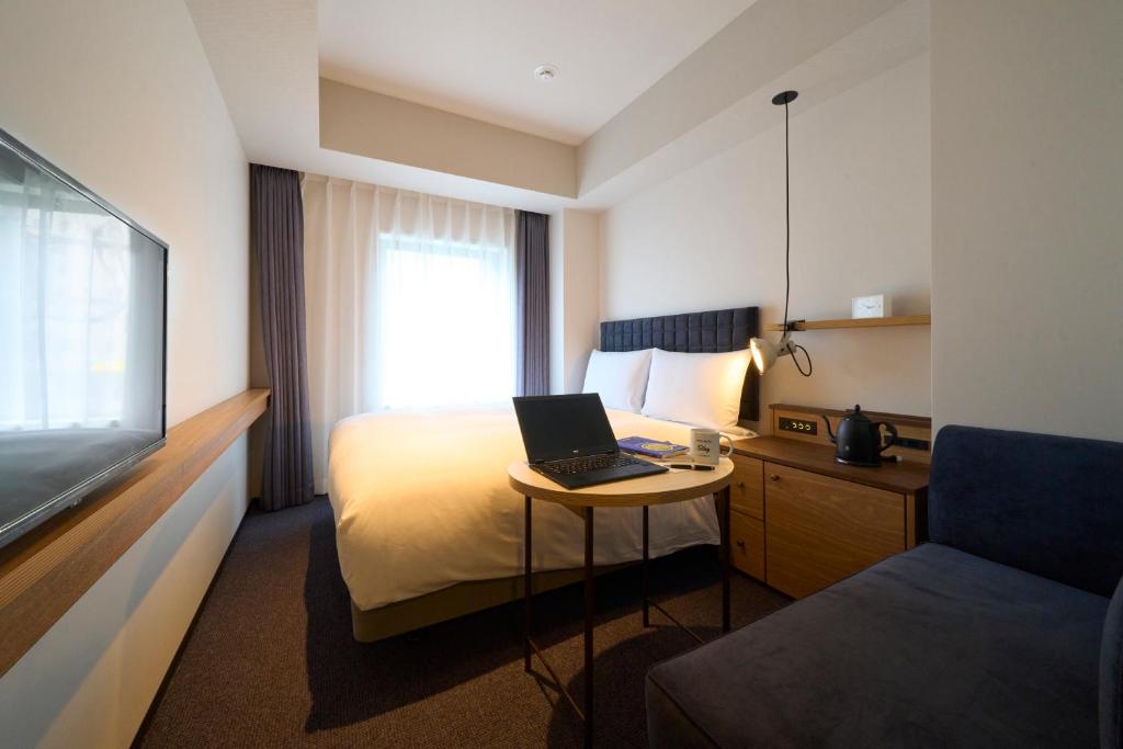 Postel nebo postele na pokoji v ubytování Hotel Resol Stay Akihabara