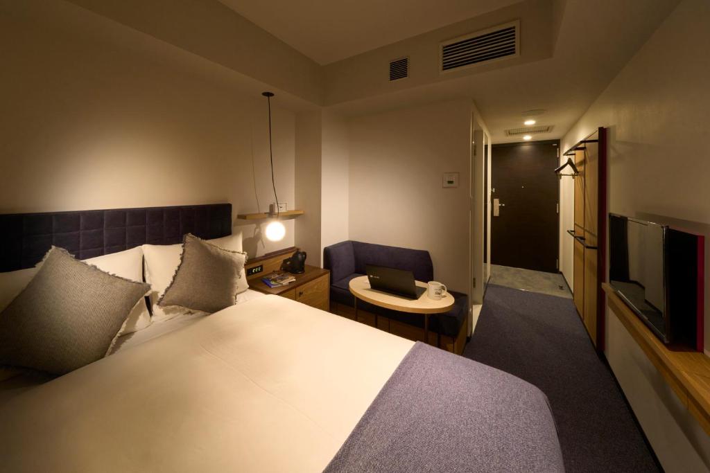 Postel nebo postele na pokoji v ubytování Hotel Resol Stay Akihabara