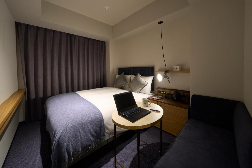 Postel nebo postele na pokoji v ubytování Hotel Resol Stay Akihabara