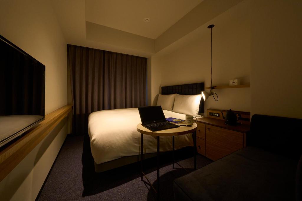 Postel nebo postele na pokoji v ubytování Hotel Resol Stay Akihabara