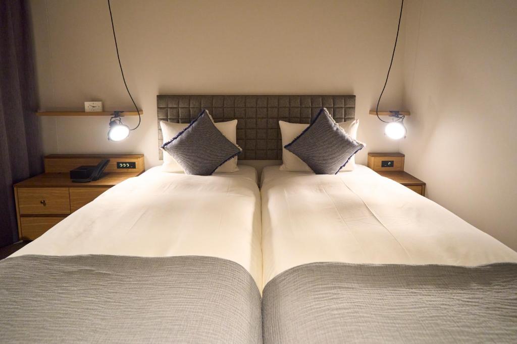 Postel nebo postele na pokoji v ubytování Hotel Resol Stay Akihabara
