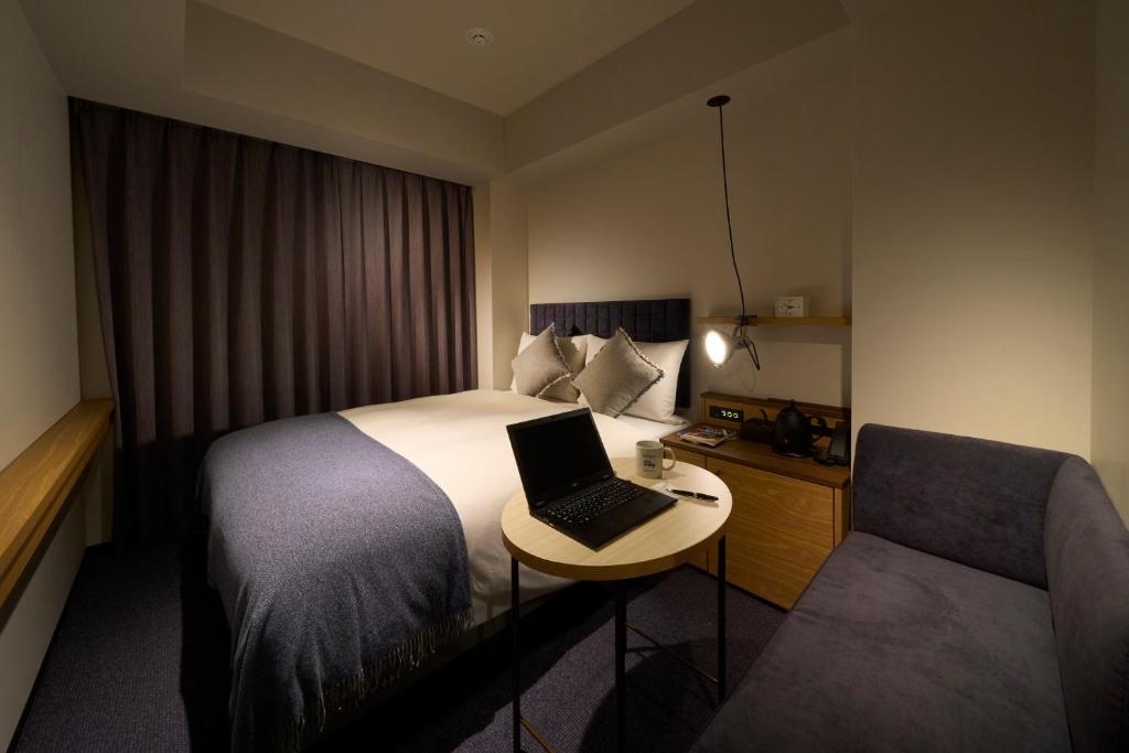 Postel nebo postele na pokoji v ubytování Hotel Resol Stay Akihabara