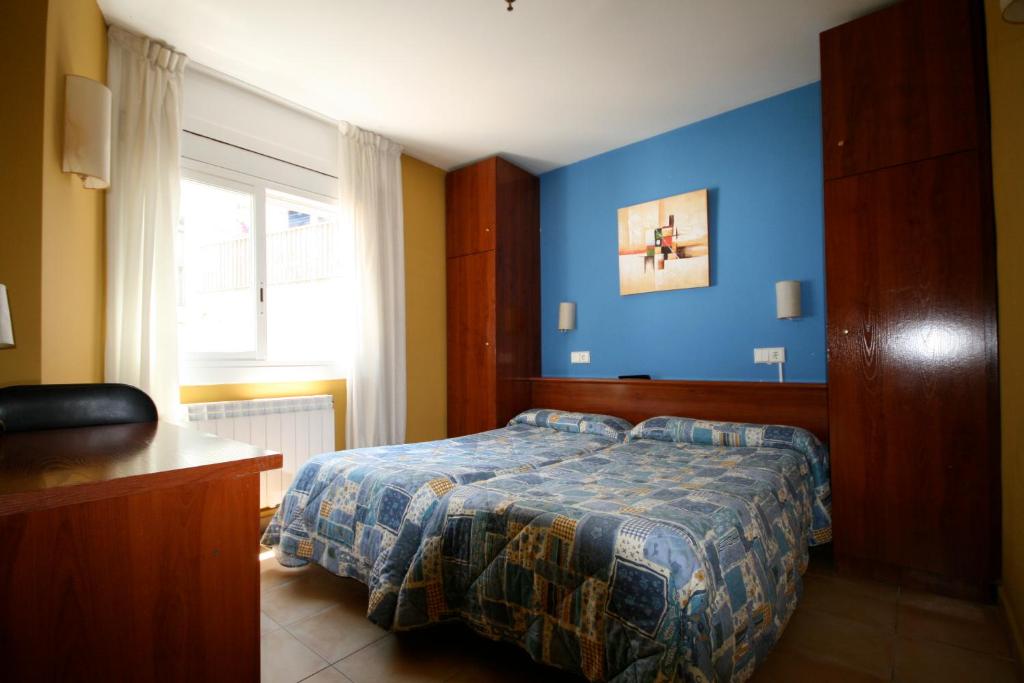 Postel nebo postele na pokoji v ubytování Hostal Termes