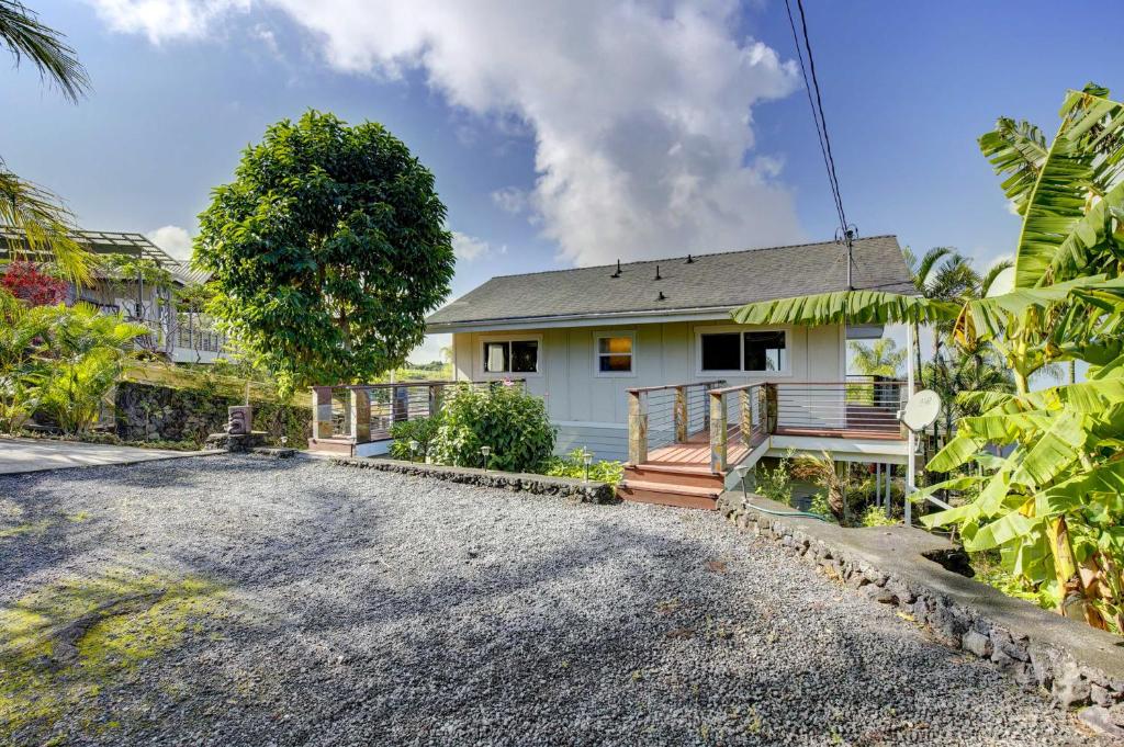 a house with a gravel driveway in front of it at Cozy Kona Coast Apt with Lanai about 8 Miles to Beach! in Kailua-Kona