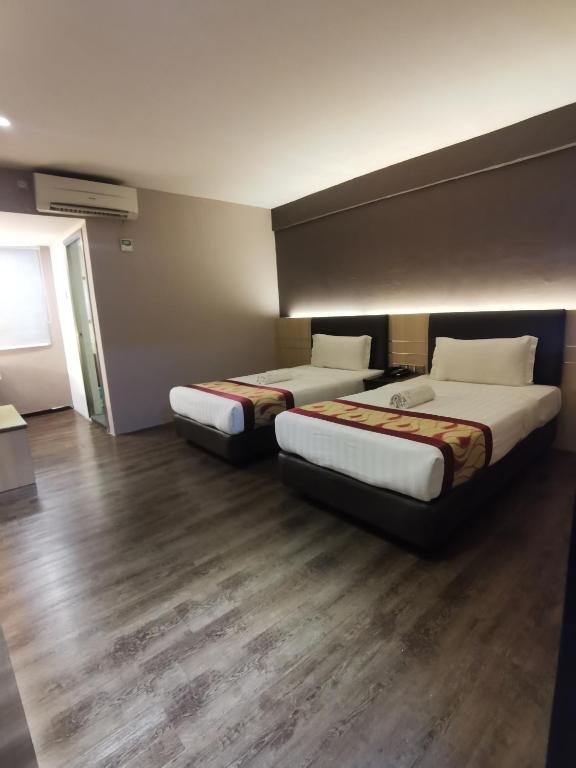 Postel nebo postele na pokoji v ubytování Palace Inn
