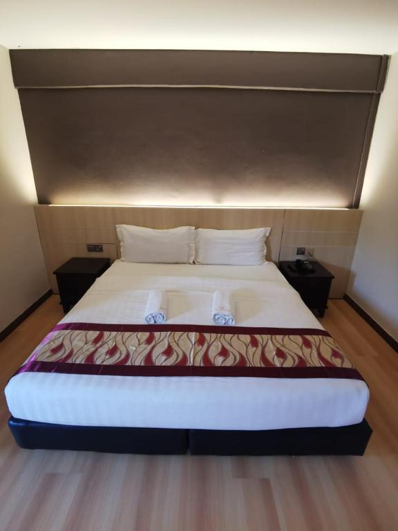 Postel nebo postele na pokoji v ubytování Palace Inn