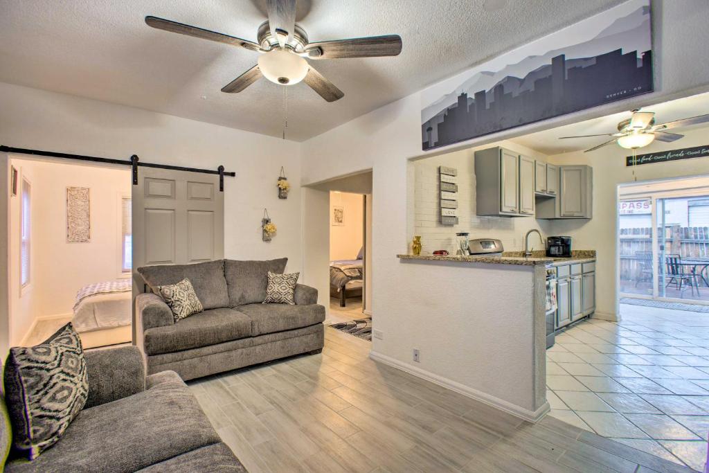 a living room with a couch and a kitchen at Beautiful Denver Retreat about 4 Mi to Downtown! in Denver