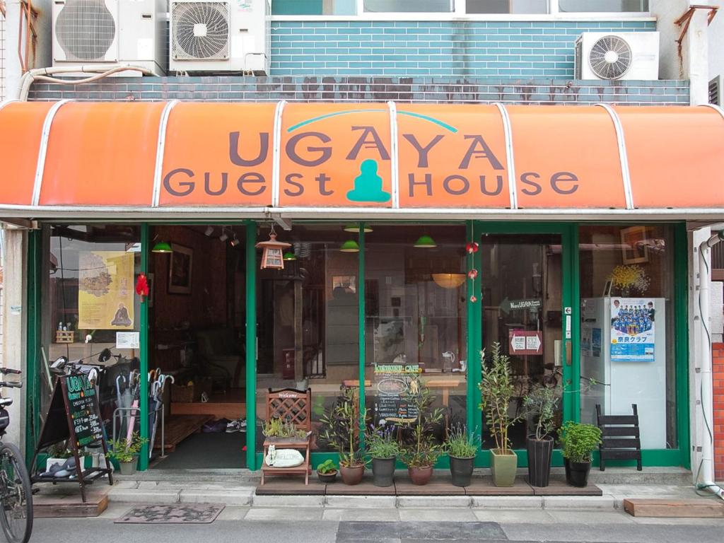 a store front with a sign that reads "downtown" at Nara Ugaya Guesthouse in Nara