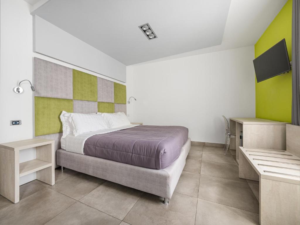Postel nebo postele na pokoji v ubytování Orange Suites - De Vivo Realty Sorrento