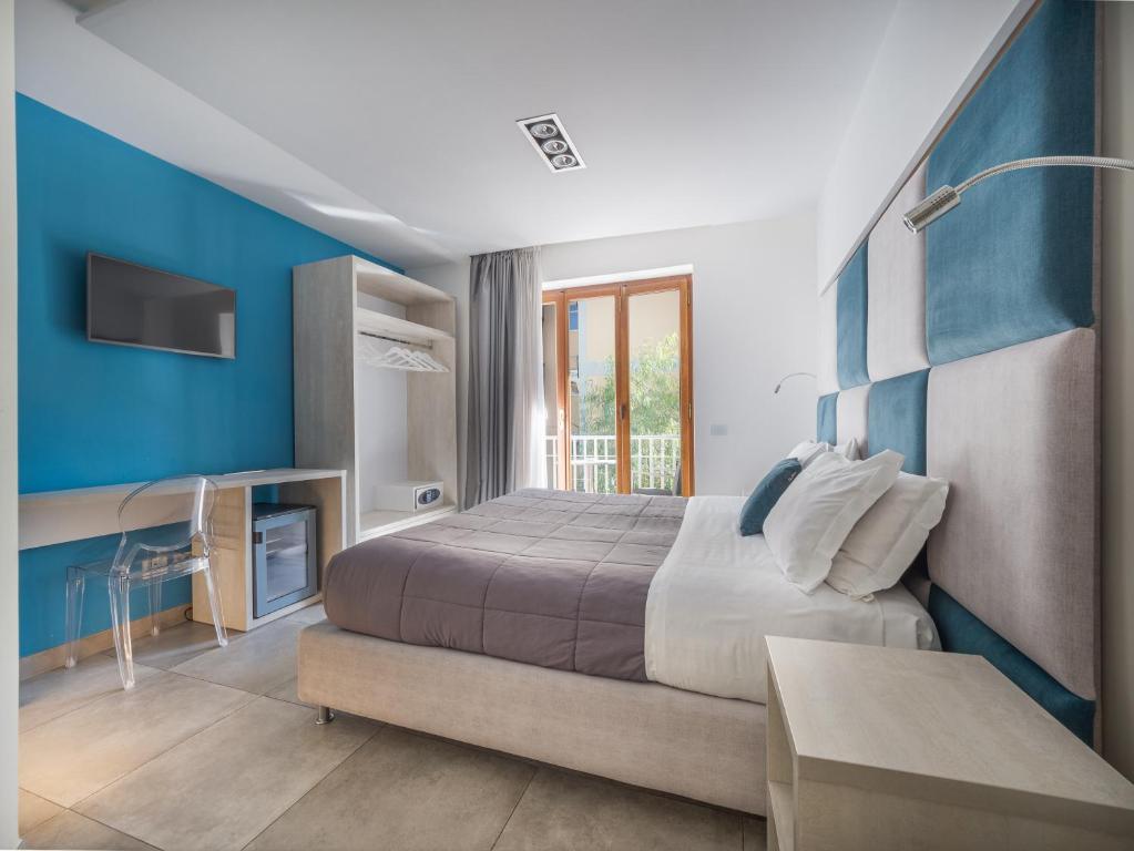 Postel nebo postele na pokoji v ubytování Orange Suites - De Vivo Realty Sorrento