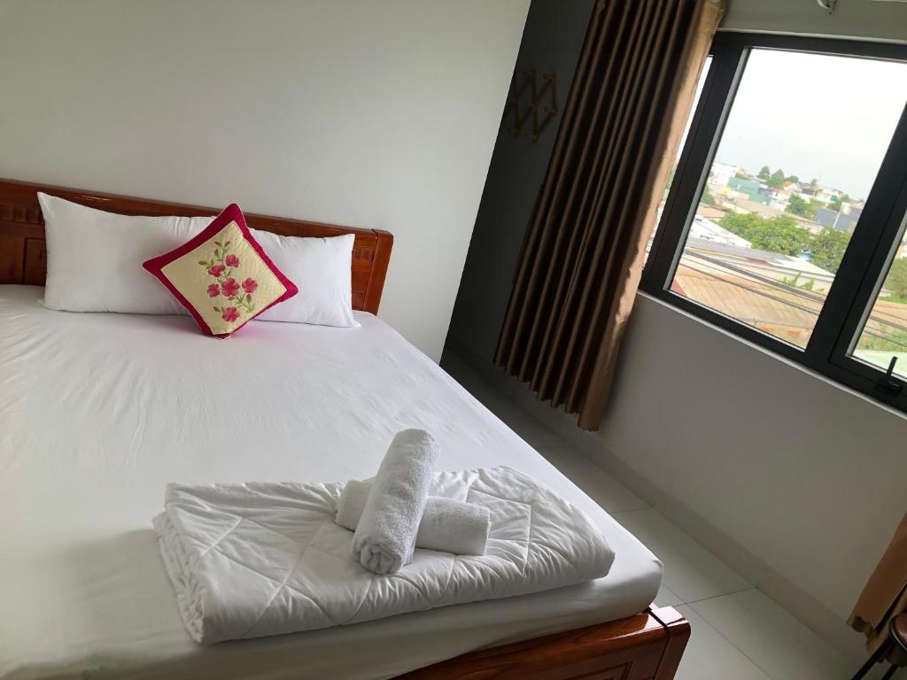Кровать или кровати в номере Khách sạn Huy Phương