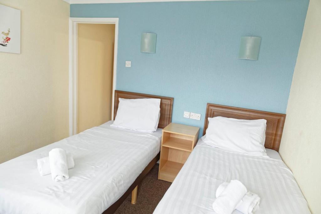 Postel nebo postele na pokoji v ubytování Sand Bay Holiday Village - Adults Only