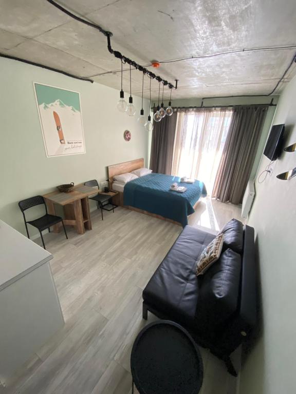 Postel nebo postele na pokoji v ubytování Your Cozy Apartment in New Gudauri, Loft 2 #432