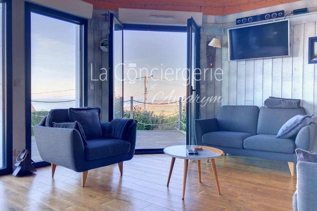 a living room with a couch and chairs and a table at AJ 09 - Villa "Le Hublot" in Ault