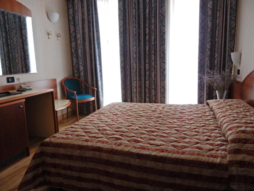 Postel nebo postele na pokoji v ubytování Hotel Brennero
