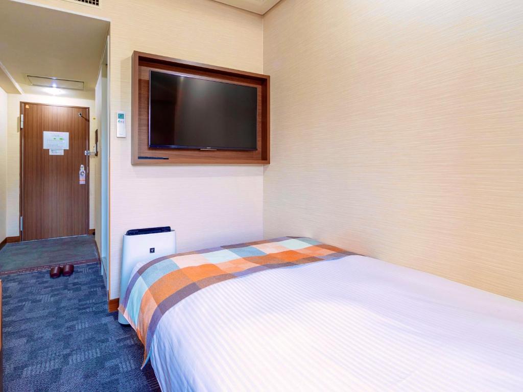 Postel nebo postele na pokoji v ubytování Central Hotel Okayama