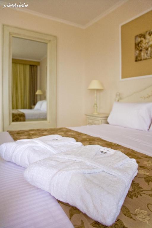 Postel nebo postele na pokoji v ubytování Hotel Astron Princess
