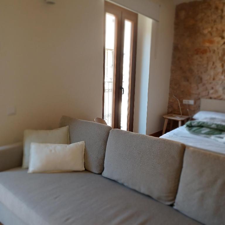 Postel nebo postele na pokoji v ubytování Apartaments Casa el Metge