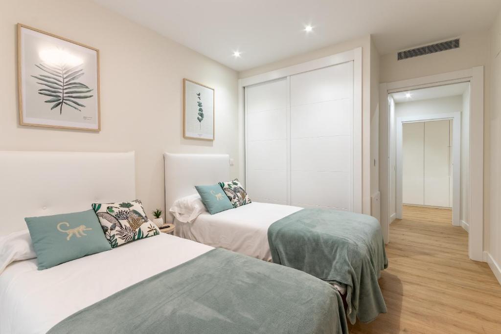 A bed or beds in a room at Nuevo y Luminoso en Plaza Moyua