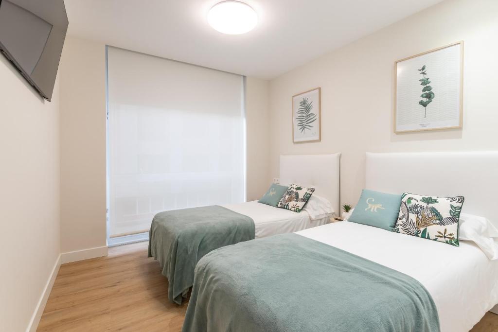 A bed or beds in a room at Nuevo y Luminoso en Plaza Moyua