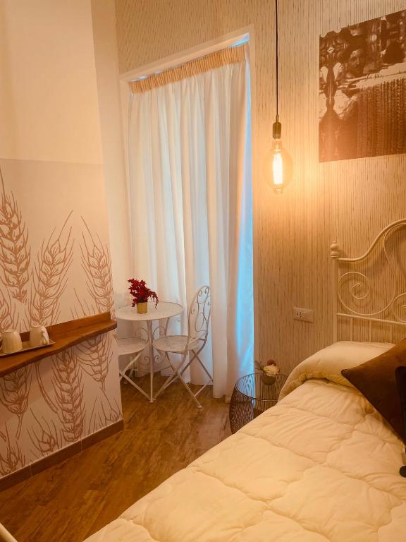 Postel nebo postele na pokoji v ubytování Granoro Gragnano B&B
