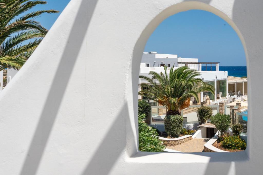 a view of the beach from the balcony of a resort at Irini Hotel in Afiartis