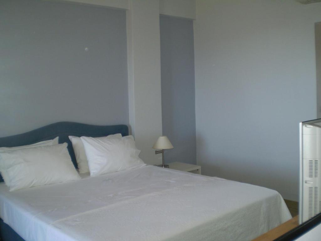 Postel nebo postele na pokoji v ubytování Athena Hotel