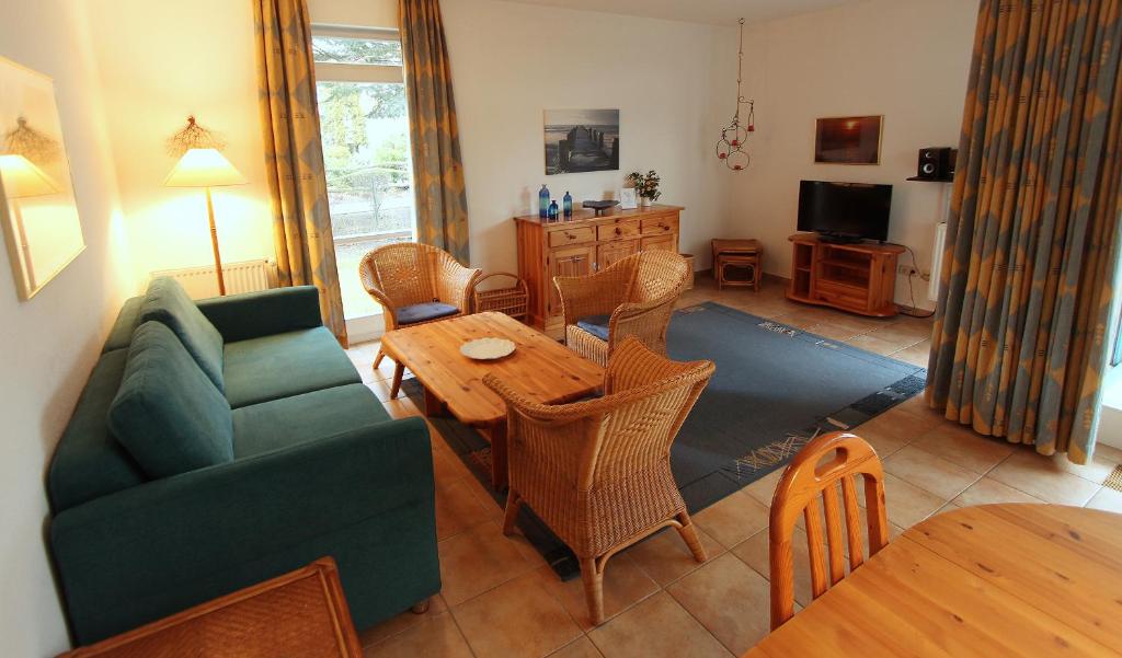 a living room with a couch and a table at Ferienwohnung Warnke in Kühlungsborn