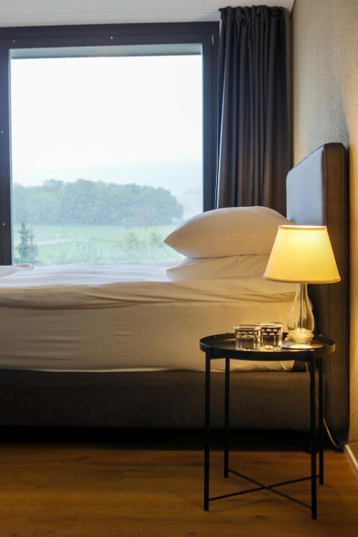 Letto o letti in una camera di Hotel de l’Ours Preles